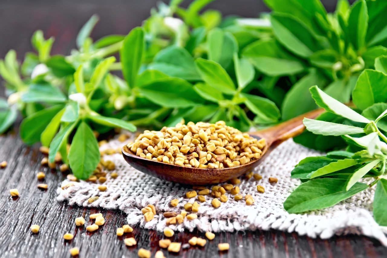 fenugreek-in-spoon-with-leaves-on-board.jpg